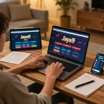 Analyzing the Jaya9 online casino interface on a laptop for strategic gameplay.