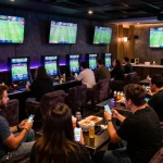 Experience the excitement of sports betting at 8XBET with bettors engaging in live matches.