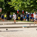 Petanque players engaged in a friendly match outdoor at fopikotapalu.org, showcasing community spirit and sportsmanship.